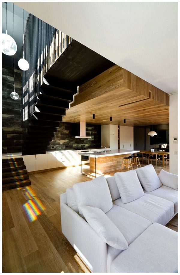 Modern-interior-with-a-high-ceiling-and-warm-wooden-surfaces