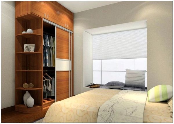 appealing-wooden-bedroom-wardrobe-closets-coupled-with-comfortbale-wide-bed-and-bay-window-sitting-space-at-contemporary-bedroom-created-on-hardwood-flooring